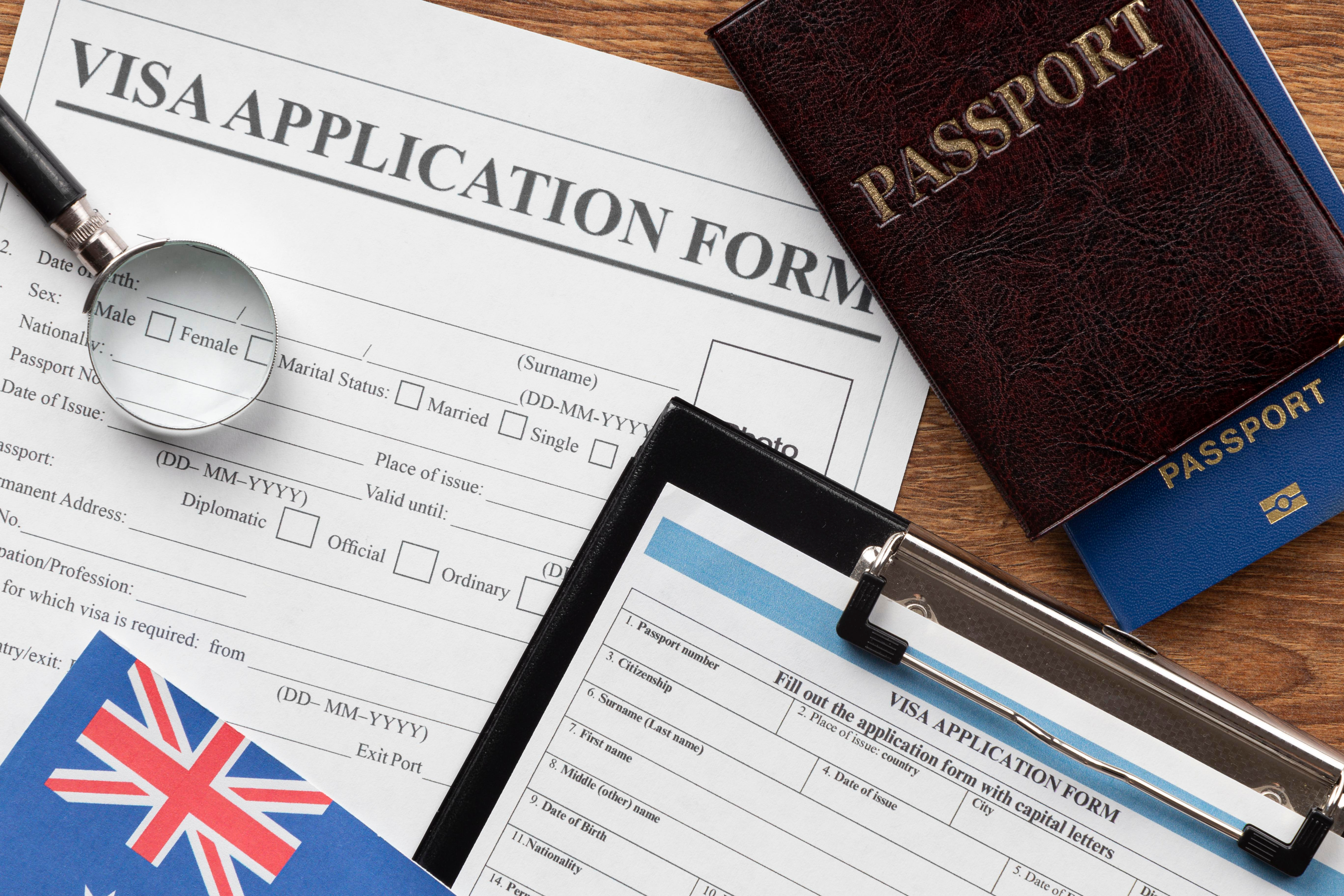 Immigration appeal paperwork laid beside travel documents and a pen for case preparation.